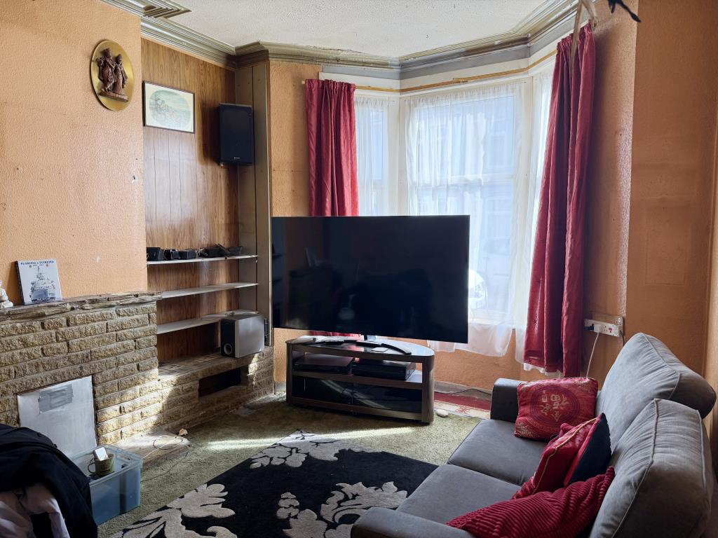 Lot: 133 - THREE-BEDROOM HOUSE IN NEED OF IMPROVEMENT - Living room with bay window